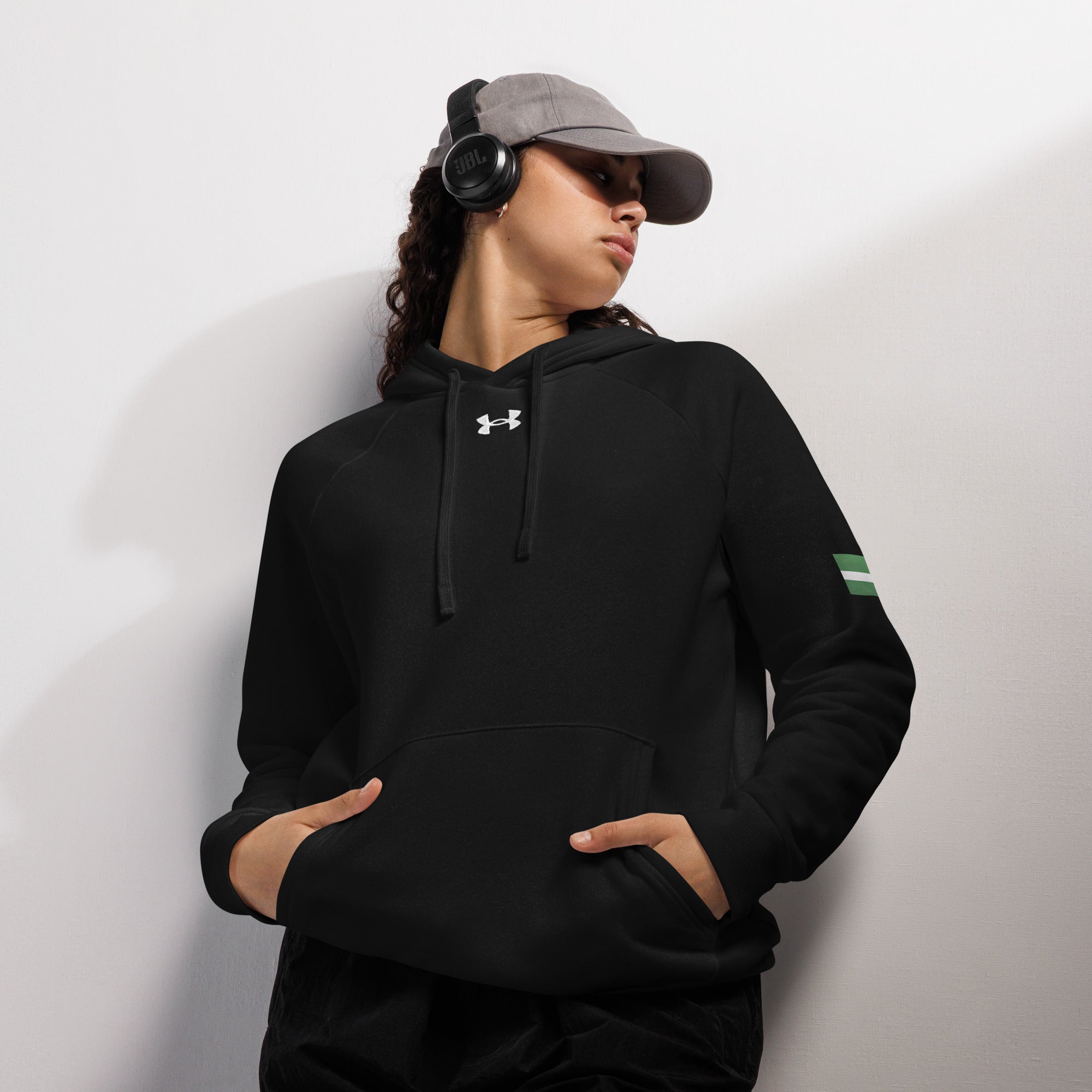 Naija Jealous Me Not Under Armour® hoodie - Naija Of Course Fashion, female model wearing a cap and headphones, front view